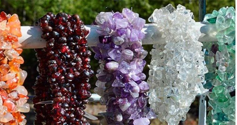 Different color and shapes of gemstones sell by Treasure Outpost Rock Shop