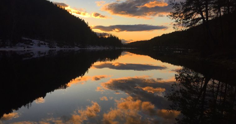 Nighttime view of the lake with stunning sunset in Bigfork Pines State Park
