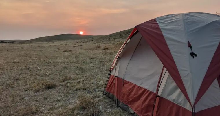 Tourist tent with beautiful sunset in the Home Gun Primitive Camping