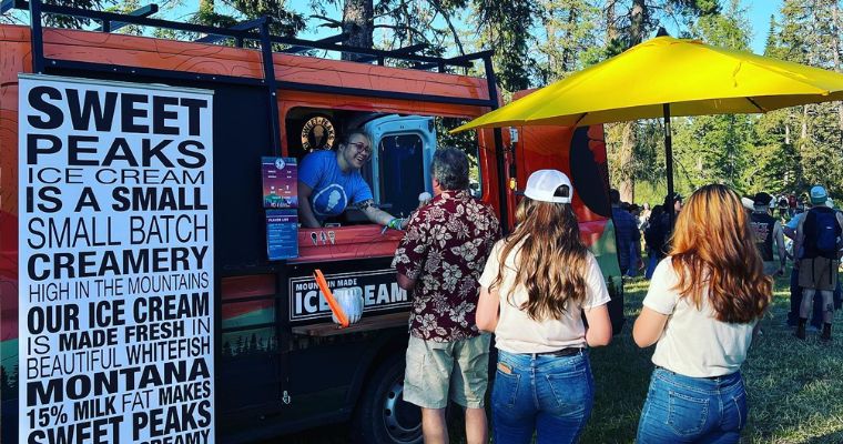 The Sweet Peaks Ice Cream truck in the forest with their delicious ice cream choices
