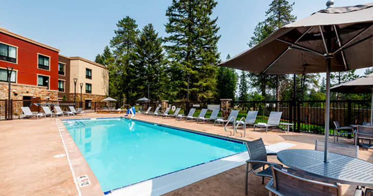 TownePlace Suites outdoor pool surrounded by trees