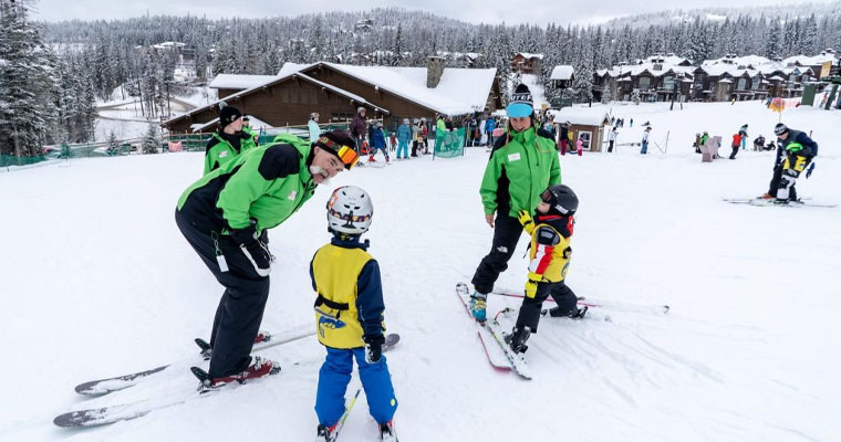 Two children enjoys Ski session with their private mentor during Whitefish Mountain Resort Ski Season