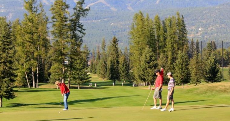 Group of locals playing a golf in the Whitefish Lake Golf Club