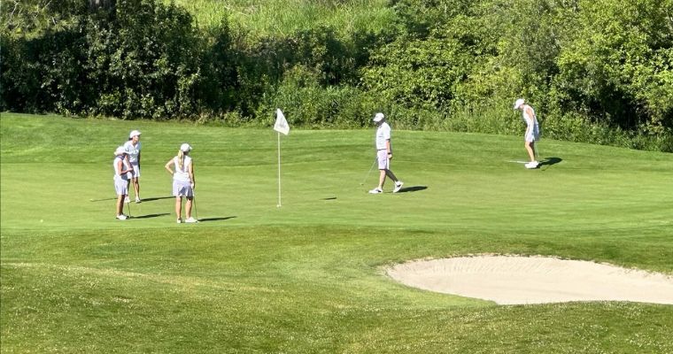 Family of tourist enjoys playing golf in the Buffalo Hill Golf Club