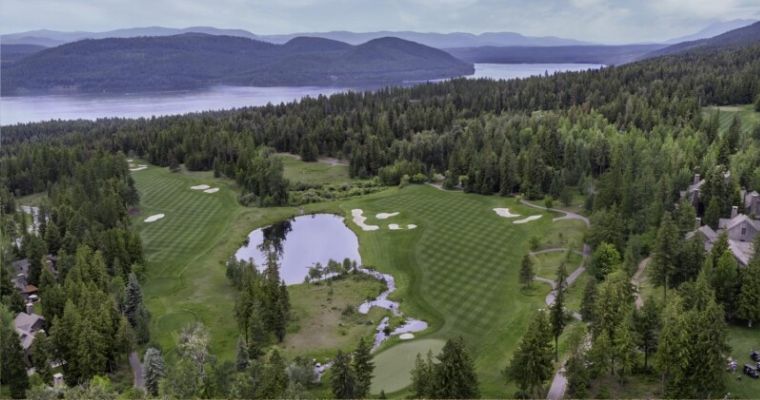Aerial view of a golf course in the Iron Horse Golf Club with ell maintain green grass
