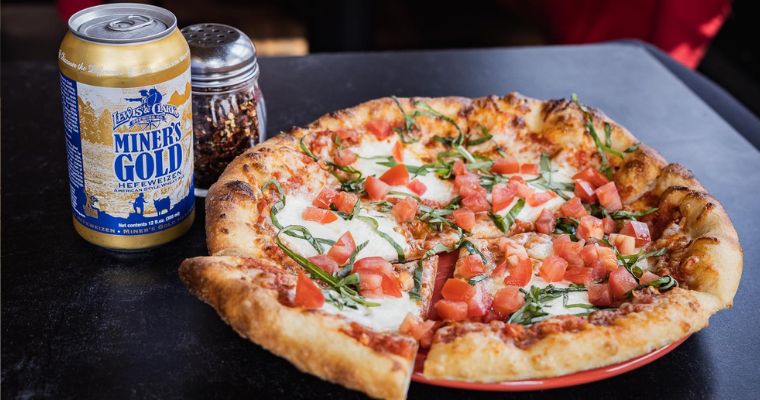 Italian classic pizza with beer serves by the Mambo