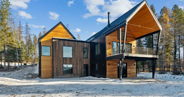 One of the Mountain Brook Lane Project home featuring stylish modern residence with a generous roof and large porch, reflecting the lifestyle in Whitefish, Montana.