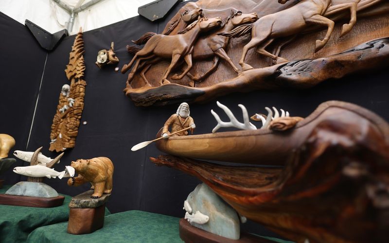 A collection of beautiful wooden carvings showcased at Whitefish Arts Festival celebration.