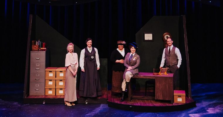 The cast of the play stands on stage, showcasing their performance at the Whitefish Theatre Company in Montana.