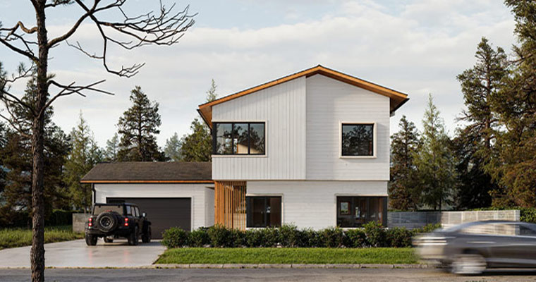 The image showcases a modern, two-story residential home exemplifying real estate development in Whitefish, Montana.