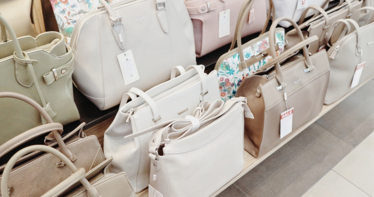 A variety of purses displayed in a store in Whitefish, Montana, showcasing different styles and colors at Sappari.