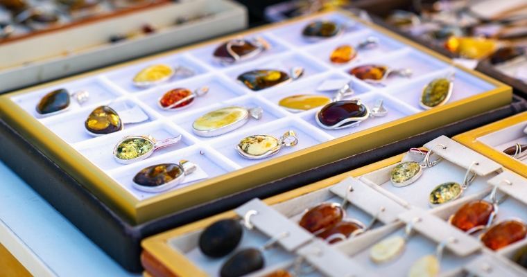 Jewelry display featuring amber and other pieces at the Treasure Outpost Rock Shop in Whitefish, Montana.