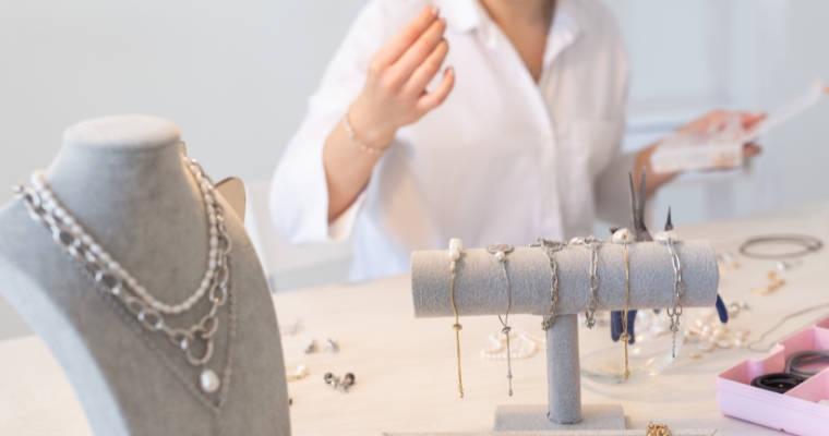 A woman examines custom jewelry in Whitefish Goldsmiths, a jewelry store in Whitefish, Montana.