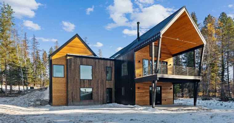 Modern home in Montana featuring a large roof and two prominent windows at 158 Mountain Brook Lane.
