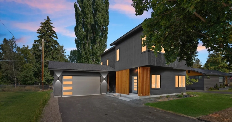 Modern home with a garage and driveway, located at 824 E 10th Street, Whitefish.